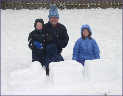 Steven, Daddy and Diana build a snow train