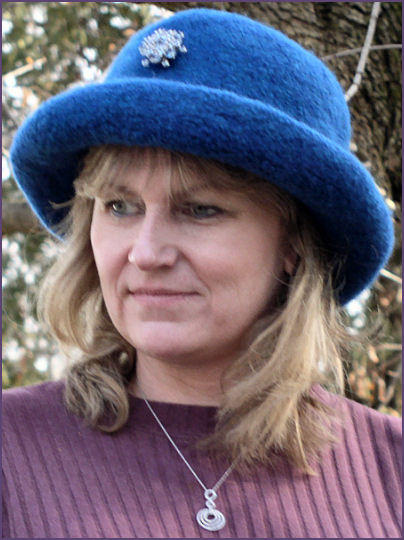 Diane, wearing teal blue hat