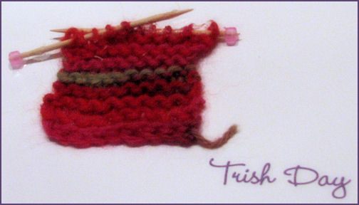 front of card with small knitted square with toothpick knitting needles