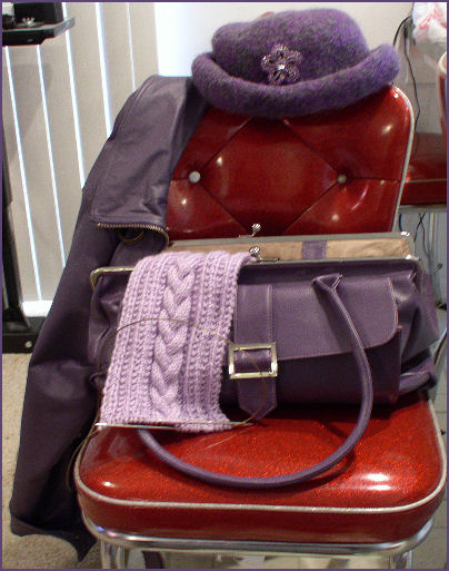 Purple purse, purple jacket, purple hat