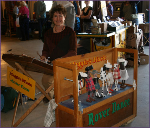 woman playing hammer dulcimer
