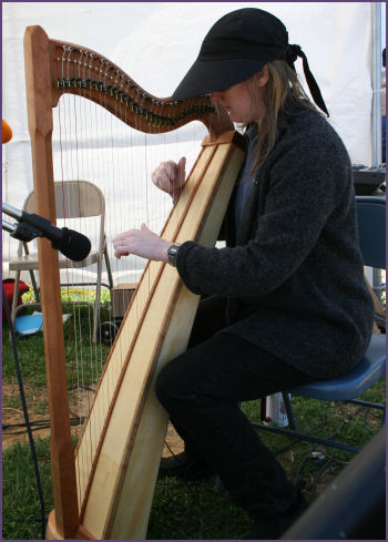 girl playing harp