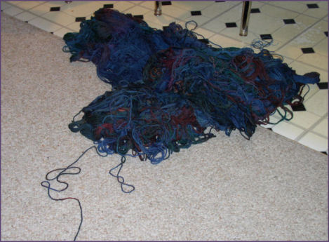 yarn in a tangled mess on the floor