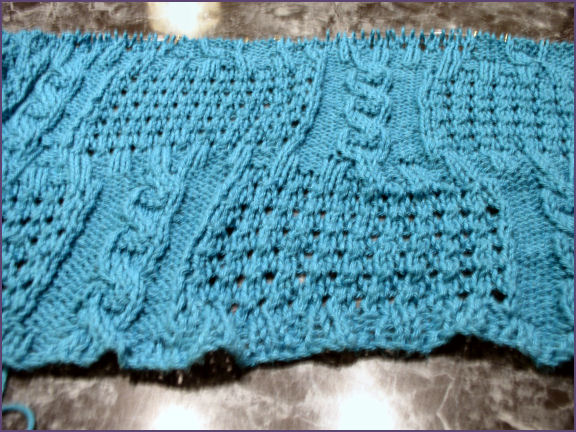 photo of baby blanket with cables and eyelets