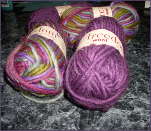 sold purple yarn and varigated green and purple yarn