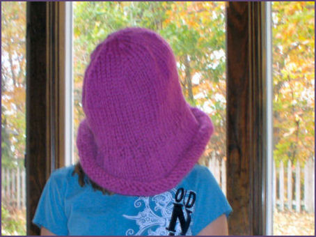 Diana models oversized hat before felting