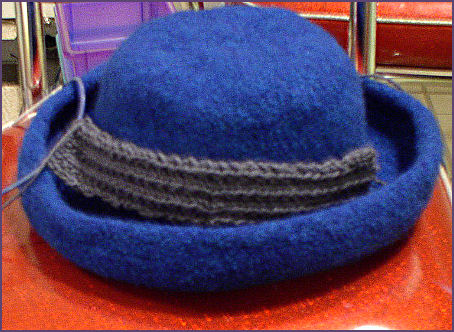 Felted hat with partially completed hat band