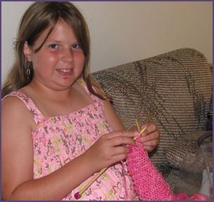 Diana adds a couple rows to her scarf