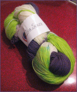 Hank of yarn in lime, white and dark purple