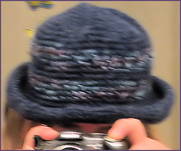 blue crocheted hat with brim