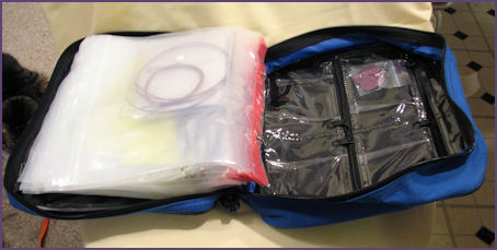 worm binder, inside, showing zipper pockets on inside back cover