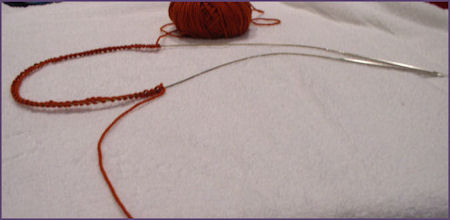 slide stitches to cable of circular needle