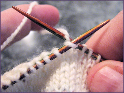 me, happily knitting on baby sweater after cable stitches are fixed me, happily knitting on baby sweater after cable stitches are fixed