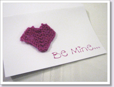 knitted heart on a greeting card