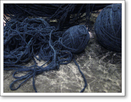 navy blue silk yarn in a big heap of a mess