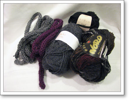 two i-cords next to balls of yarn two i-cords next to balls of yarn