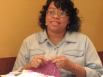 Alice is working on a poncho. Alice is working on a poncho.