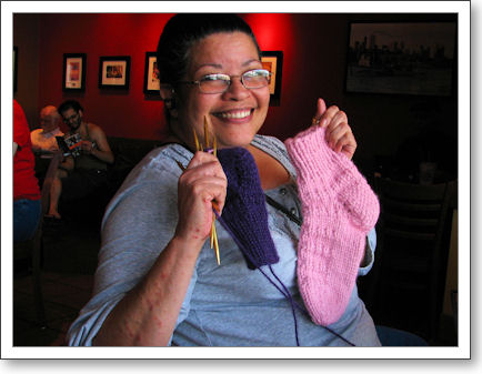 Sylvia proudly shows her first sock Sylvia proudly shows her first sock