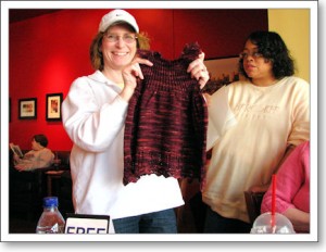 Tammy shows off a sundress for her granddaughter while Alice admires her work.