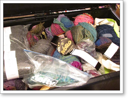Storage ottoman, full of yarn Storage ottoman, full of yarn