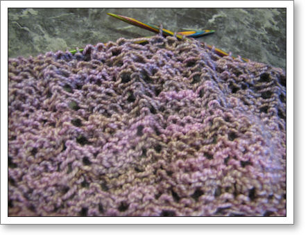 closeup of shawl in progress with knitting needles