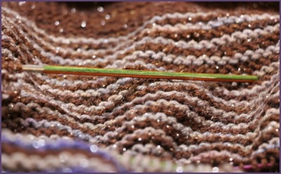 Closeup of brown, gray and blue striped shawl
