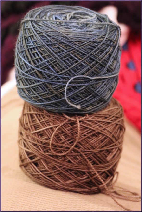 two yarn balls, one medium blue and one medium brown