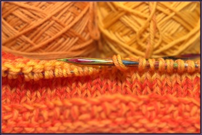 Photo of orange yarn taken with flash
