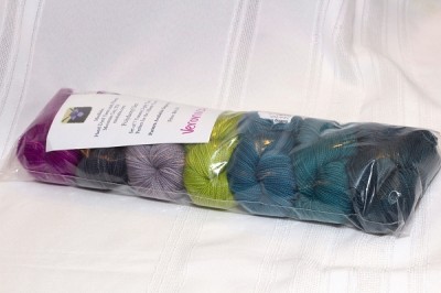 mini skeins of yarn in greens, blues and purples