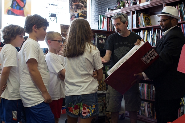 Group of campers visits the comic book store